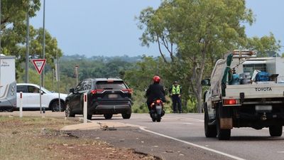 NT Police locate body of woman after leg was discovered on Stuart Highway, two people arrested