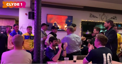 Scotland fans applaud Ukraine supporters into pub after World Cup play-off