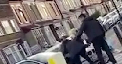 Women throw punches and pull each other's hair in brutal scrap filmed at busy junction