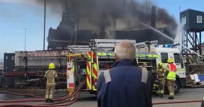 Boat engulfed in flames in Scots harbour as crews fight to battle blaze