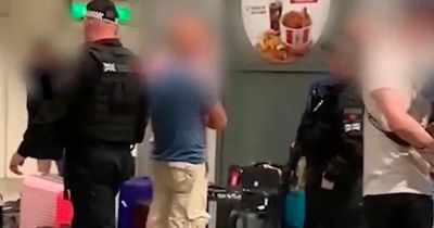 Manchester Airport passengers storm baggage carousel to grab stranded luggage