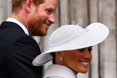 Cheers and some jeers as Prince Harry and Meghan return to UK