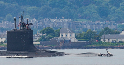 Scot captures incredible photo of dolphins escorting US nuclear submarine near Faslane