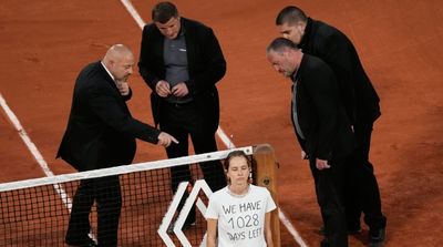 Fan Glues Herself to the Net During French Open Semifinals