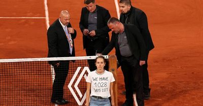 French Open semi-final interrupted as female protester ties herself to tennis net