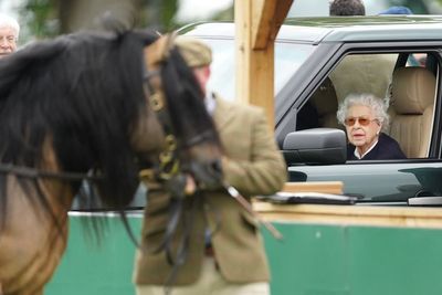 Queen in unseen footage patting and feeding beloved horses