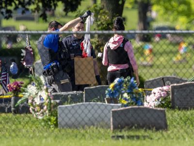 Police search for the Wisconsin cemetery shooter