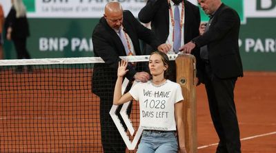 French Open Semi-final Interrupted as Protester Ties Herself to Net