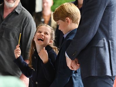 Princess Charlotte playfully attempts to conduct orchestra in Wales