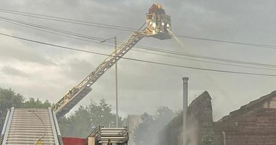 Roads taped off as huge fire rips through town centre building