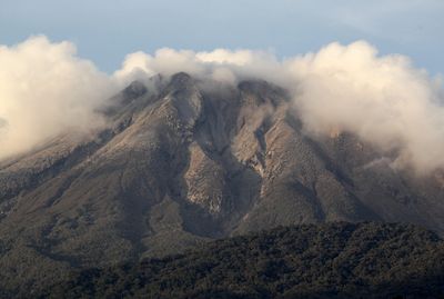 Philippines raises alert level at restive volcano after spewing cloud of ash