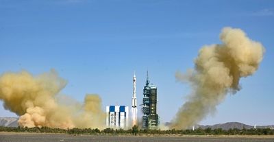 China sends three astronauts to complete space station