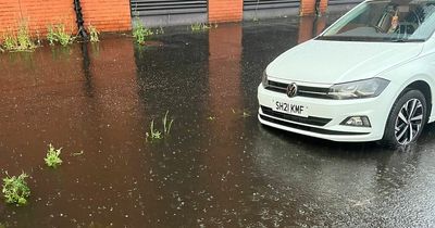 Glasgow street floods after light rain with pedestrians struggling to avoid giant puddles