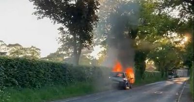 'Terrifying' road closed as car and motorcycle burst into flames