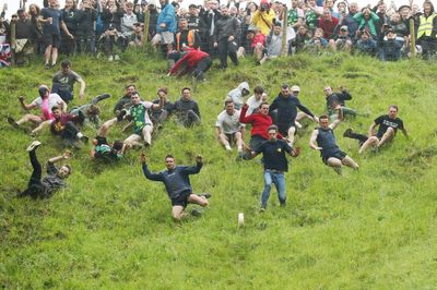 13 incredible photos of the wildly entertaining 2022 Cheese Rolling contest