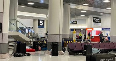 Woman's fury after she's kept on plane for hours before passengers greeted with 'sea' of abandoned bags strewn across Manchester Airport