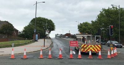 Busy road forced to shut after 'large quantity' of 'cooking oil' spilt