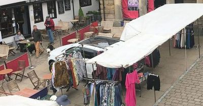Traders surround illegally parked Audi and set up shop over Bank Holiday weekend