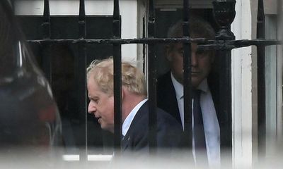 Glum and distracted, Boris Johnson tries to bounce back from boos