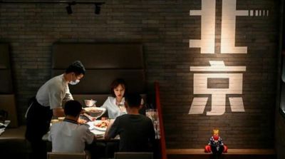 Relief, Caution in Beijing as City Lifts Covid Dine-in Curbs