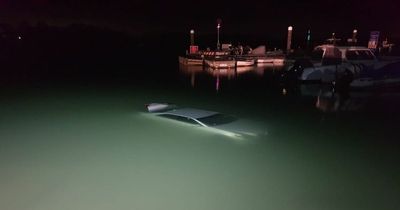 Driver rushed to hospital after reversing down boat launching slip