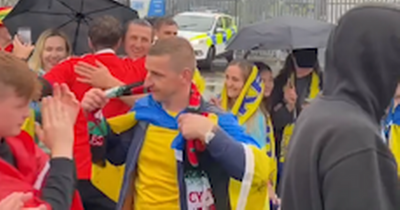 The moving scenes nobody saw outside the stadium as Wales and Ukraine fans applauded each other