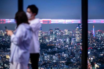 Japan to ask foreign tourists to wear masks, take out insurance