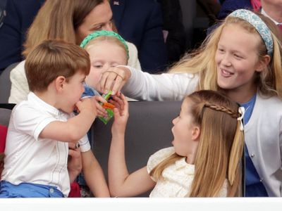 Prince Louis captured bickering with his cousins over a pack of sweets in hilarious jubilee pageant moment