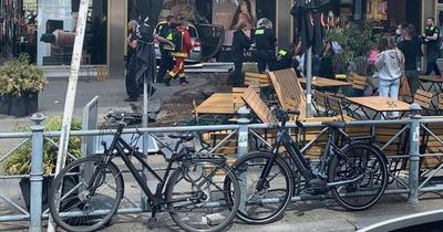 Berlin crash: car smashes into crowd of people outside busy store