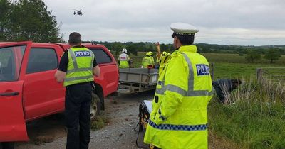 Pedestrian airlifted to hospital after horror crash with pick-up and car as cops look for tractor driver