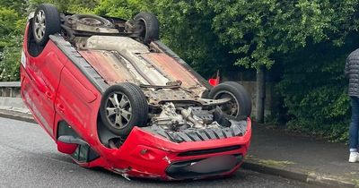 Glasgow driver escapes unscathed after van flips onto roof on city street