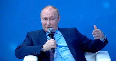 Vladmir Putin's 'slumped pose' with clothes 'askew' in bizarre public appearance