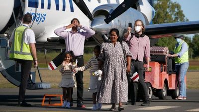 Biloela Tamil asylum seeker family make tearful return home after four-year struggle against deportation