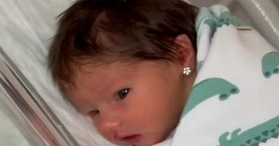 Mum faces backlash after piercing newborn's ears at two days old - but defends decision