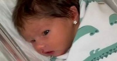 Mum slammed for piercing newborn's ears at just two days old hits back at critics