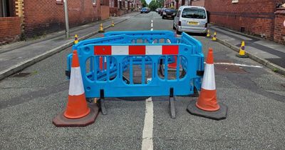 Residents asked to 'minimise' car movements after sinkhole opens up in road