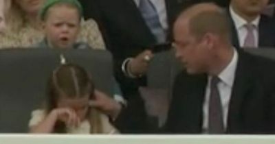 Sweet moment Prince William brushes Charlotte's hair behind shoulder as she becomes restless