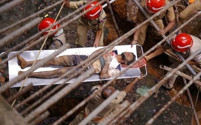 Two migrant workers injured as land caves