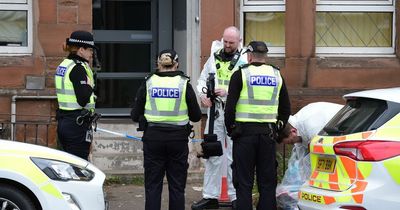 Police and forensic squads descend on Rutherglen attempted murder scene as man fights for life