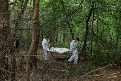 Ukraine exhumes seven bodies of people it says were killed by Russian forces