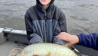 Celebrating a first muskie and a first Canadian trip with three generations of family