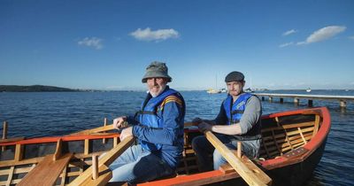 Hunter men launch their hand-crafted traditional Irish wooden boat on Lake Macquarie