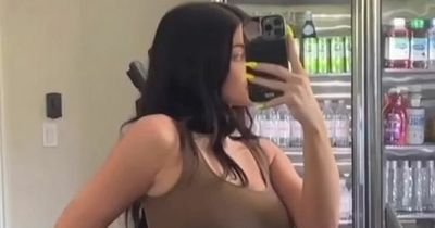 Kylie Jenner flaunts tiny waist despite struggles with 'back and knee pain' postpartum