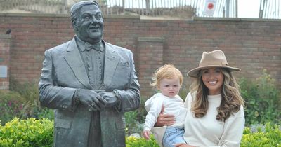 Charlotte Dawson visits late dad's statue with her son as she show's off her Les Dawson neck tattoo