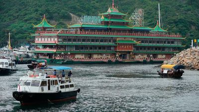 Landmark floating restaurant towed from Hong Kong harbour