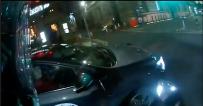 Edinburgh motorcyclist and car driver in stand-off on busy city centre junction