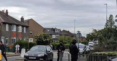 Armed cops swoop on Edinburgh street amid ongoing incident with helicopter overhead