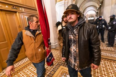 Judge to decide trial for Confederate flag-toting dad, son