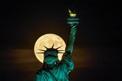 AP PHOTOS: Supermoon delights skygazers around the globe