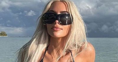 Kim Kardashian fans spot editing error as belly button vanishes in bikini snaps with Pete
